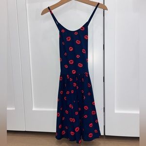 Pixie Lane short dress in navy blue with red lip print.